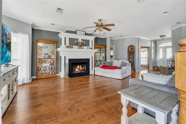 a living room with furniture and a fireplace