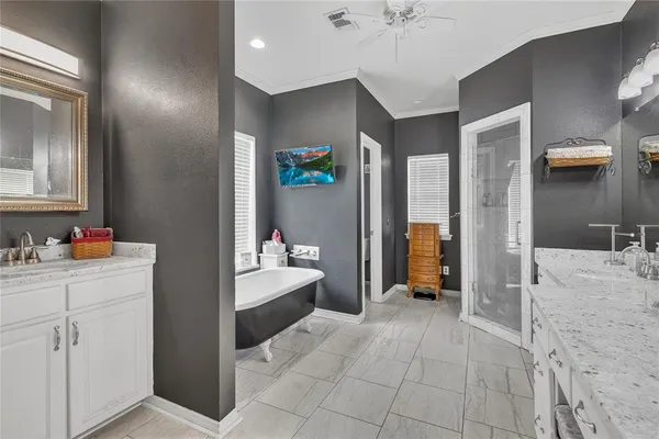 a room that has a bed and a bathroom in it