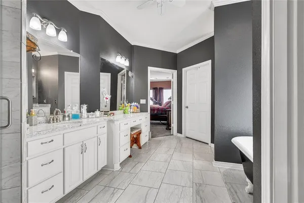 a large bathroom with a double vanity sink and a mirror