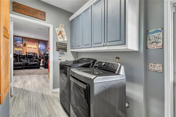 a kitchen with granite countertop a stove and a refrigerator
