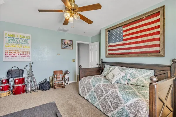 a bedroom with bed and a window