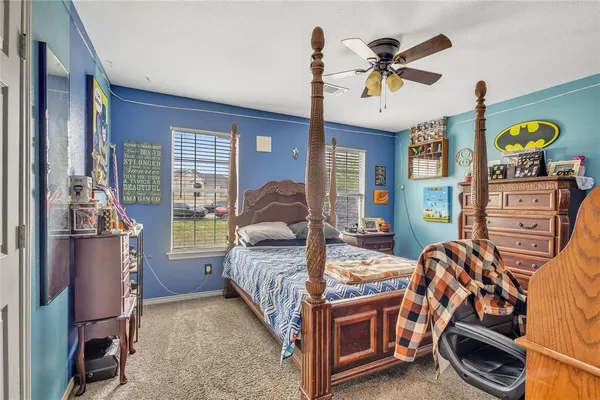 a bedroom with bed and window