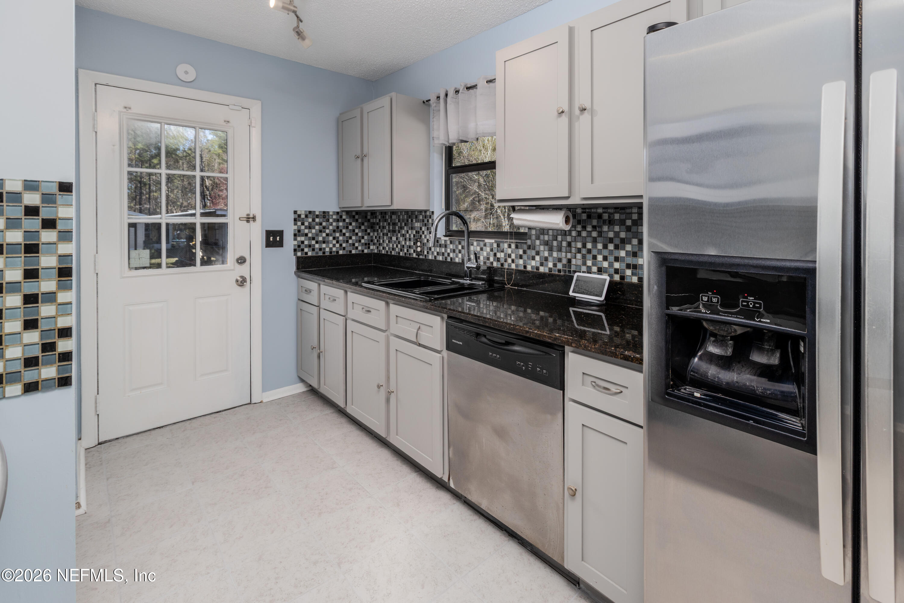 6346 Memory Lane Jacksonville, FL 32234 - Photo 11 of 32 Granite tops / tile backsplash