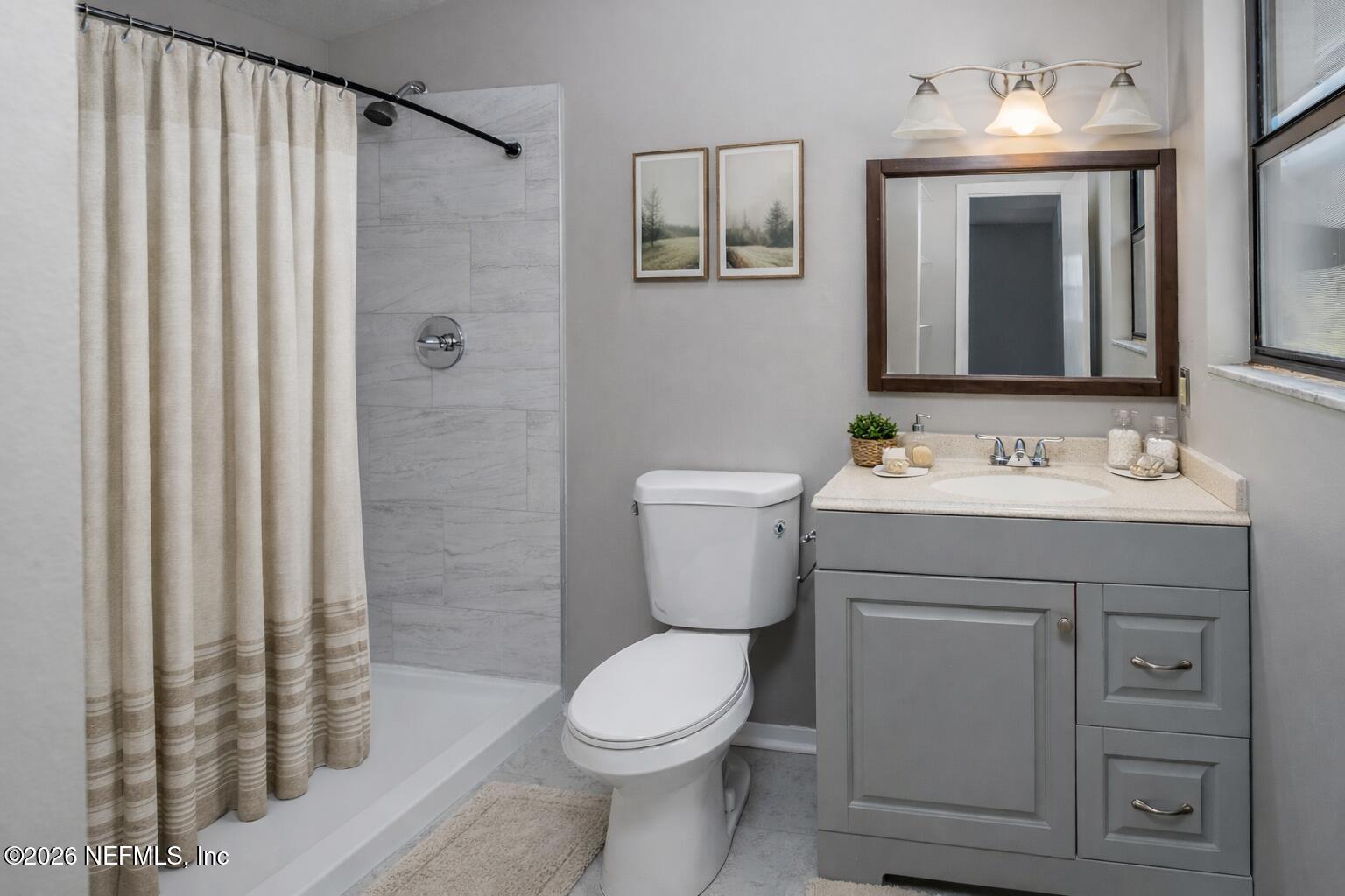 6346 Memory Lane Jacksonville, FL 32234 - Photo 16 of 32 Ensuite bath Staged