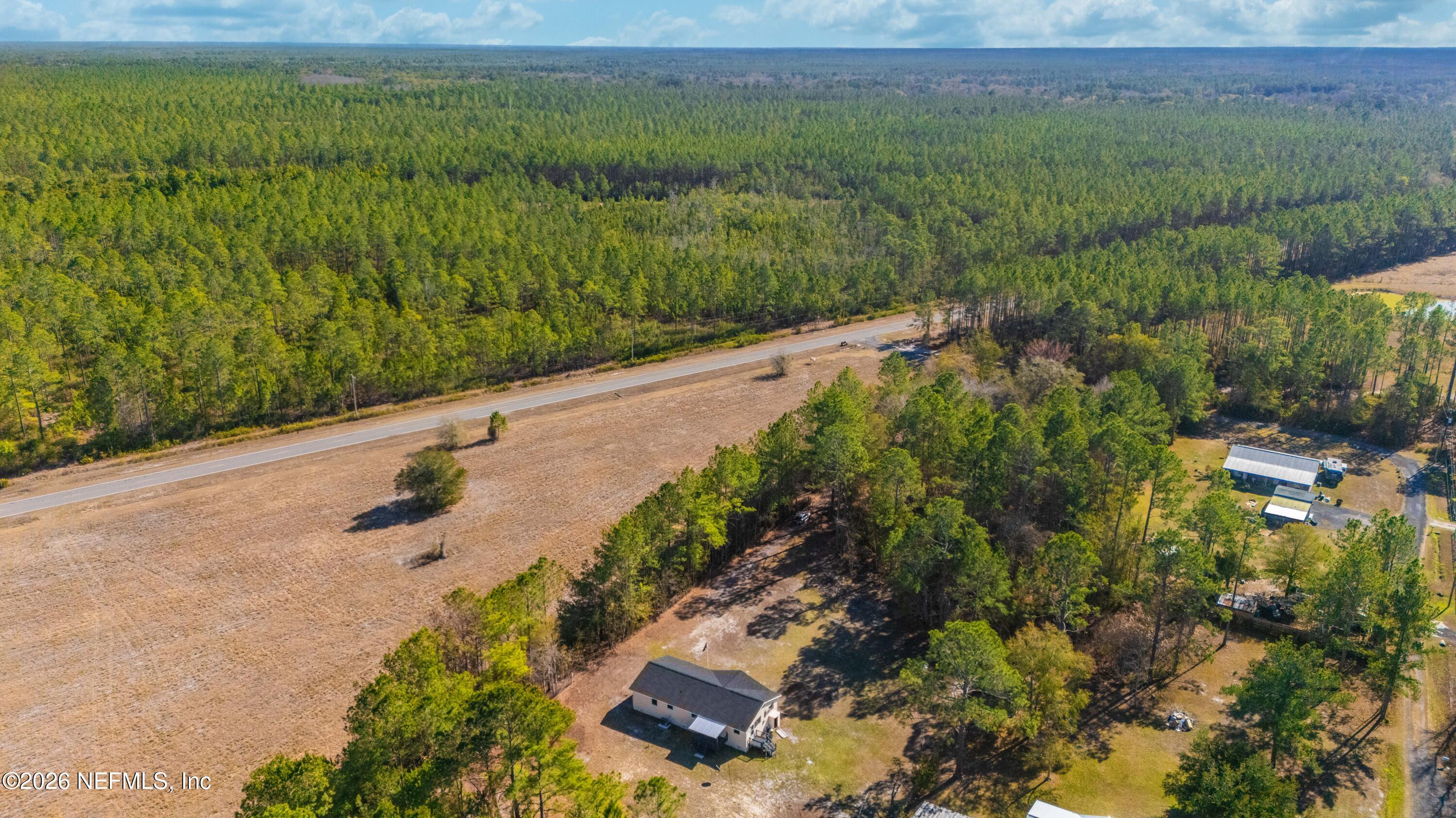 6346 Memory Lane Jacksonville, FL 32234 - Photo 27 of 31 a view of a street with a yard