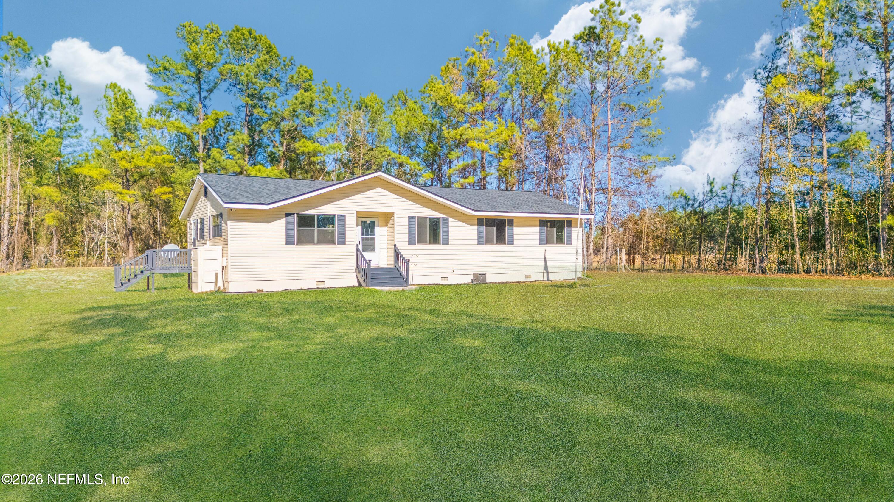 6346 Memory Lane Jacksonville, FL 32234 - Photo 31 of 31 a view of a house with a yard