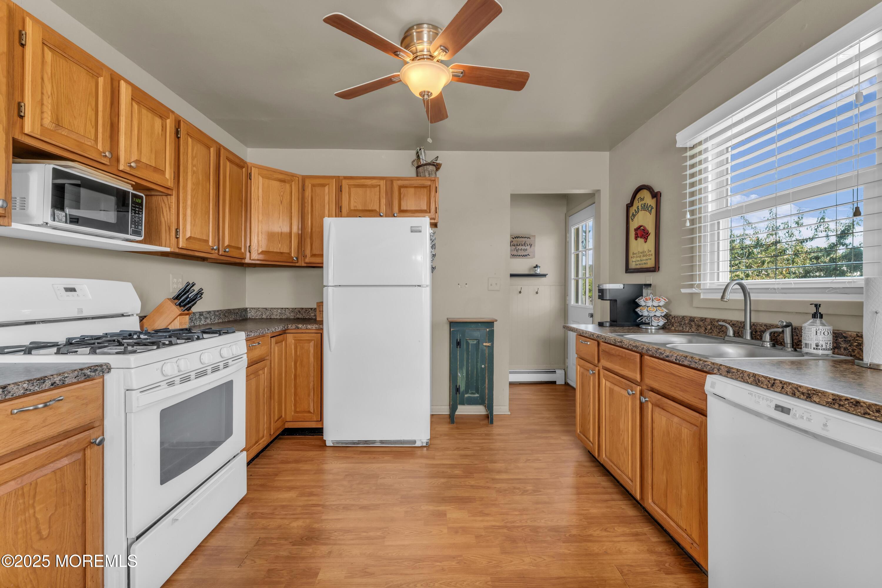 181 Mast Road Brick, NJ 08723 - Photo 11 of 24 a kitchen with stainless steel appliances granite countertop a refrigerator a stove a sink and a microwave