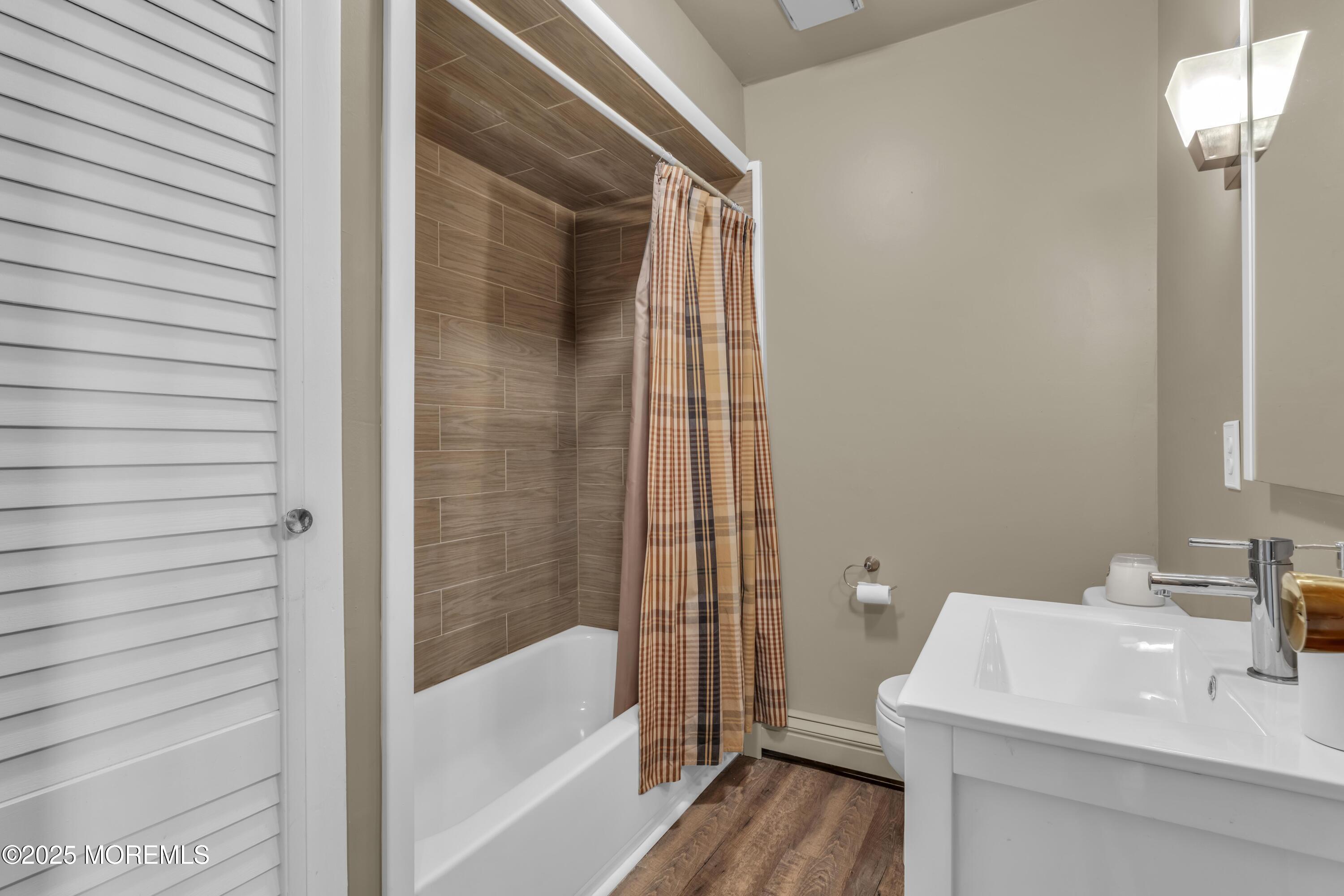 181 Mast Road Brick, NJ 08723 - Photo 13 of 24 a bathroom with a sink and a bathtub
