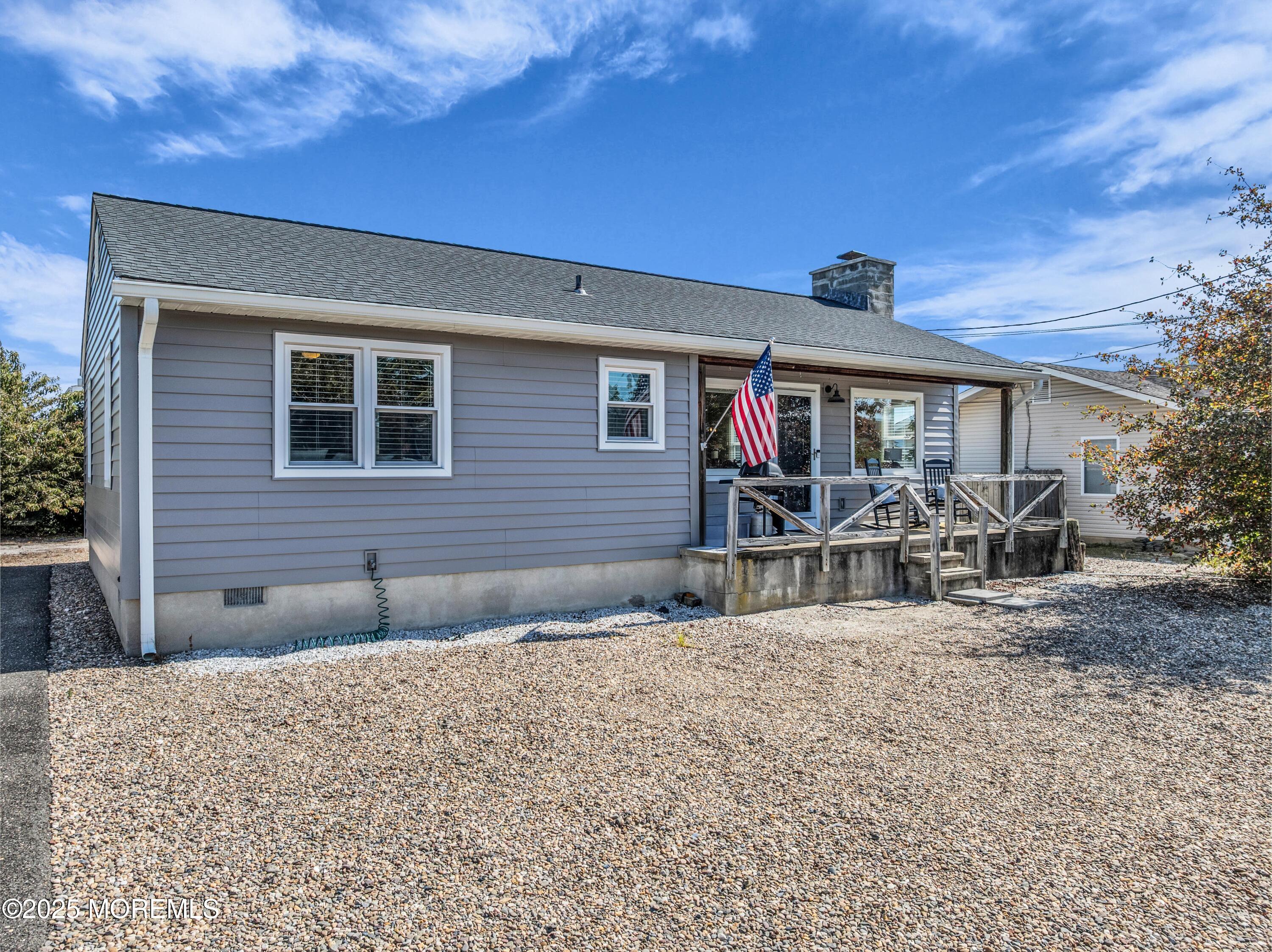 181 Mast Road Brick, NJ 08723 - Photo 3 of 24 a backyard of a house with table and chairs