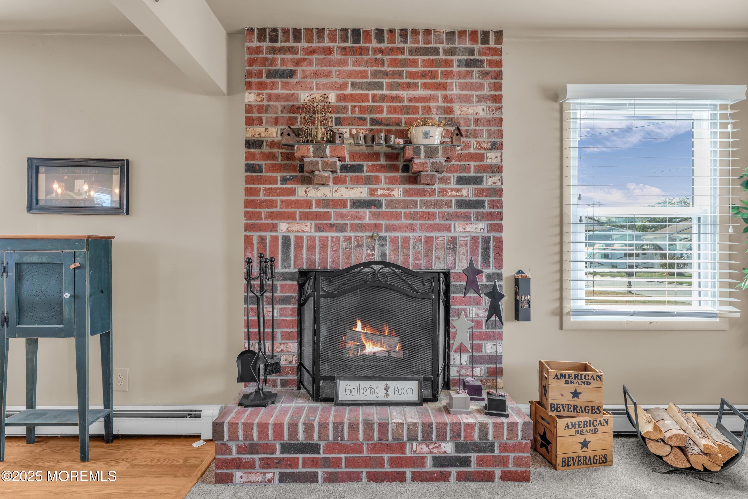 181 Mast Road Brick, NJ 08723 - Photo 6 of 24 a living room with furniture and a fireplace