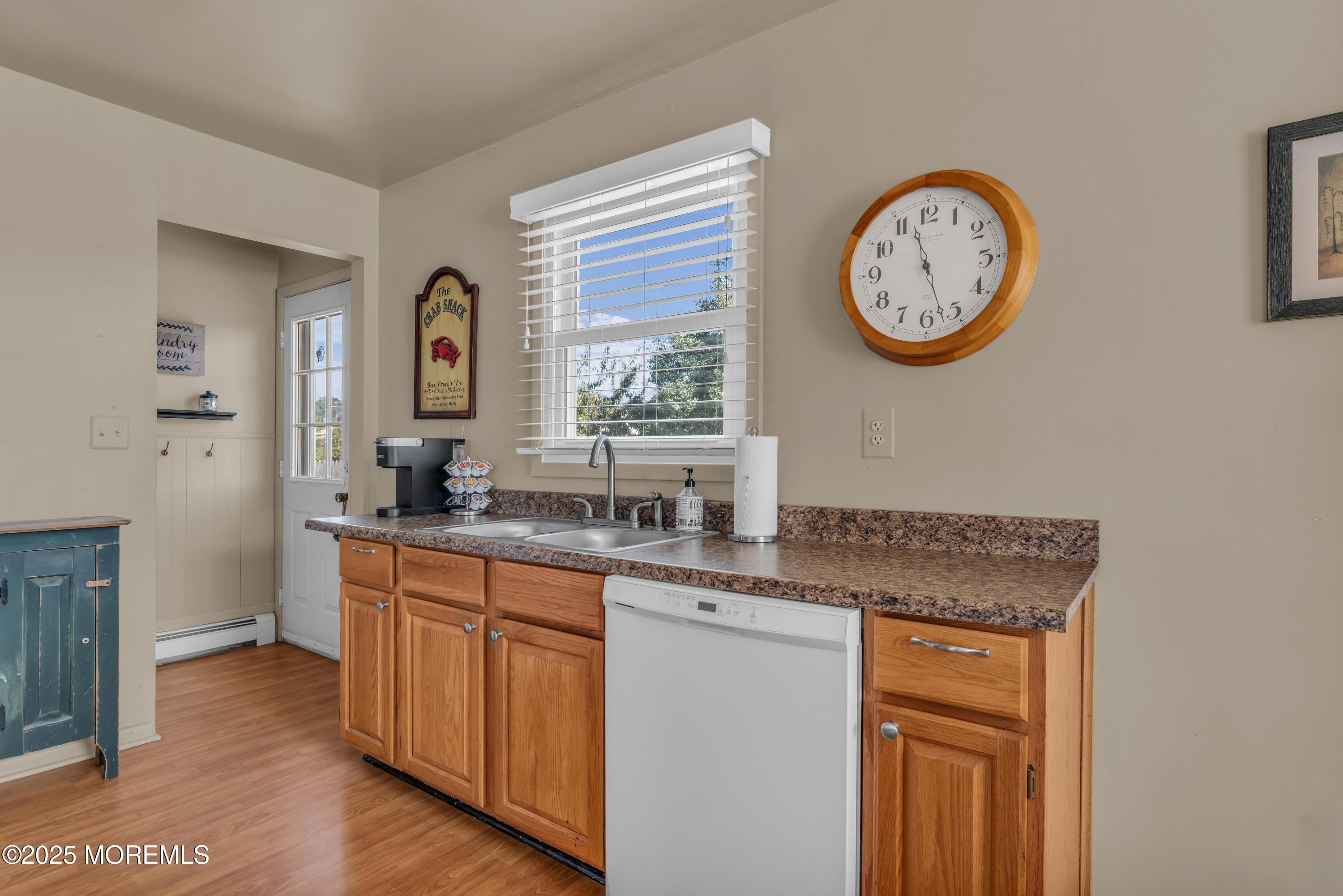 181 Mast Road Brick, NJ 08723 - Photo 9 of 24 a view of a kitchen with a sink a stove top oven and cabinets