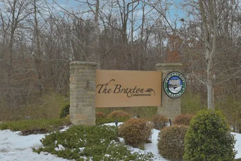 a view of outdoor space with signage and flags