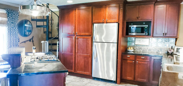426 North 7th Street Rochelle, IL 61068 - Photo 8 of 23 a kitchen with refrigerator and cabinets