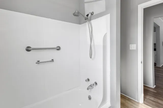 a bathroom with a shower and a bathtub
