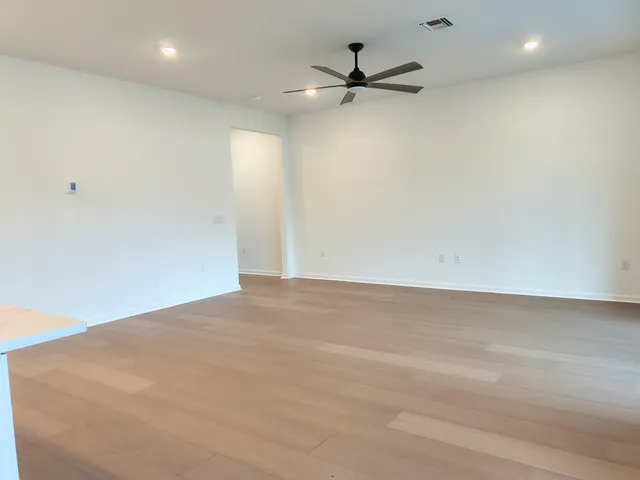 a view of a big room with wooden floor