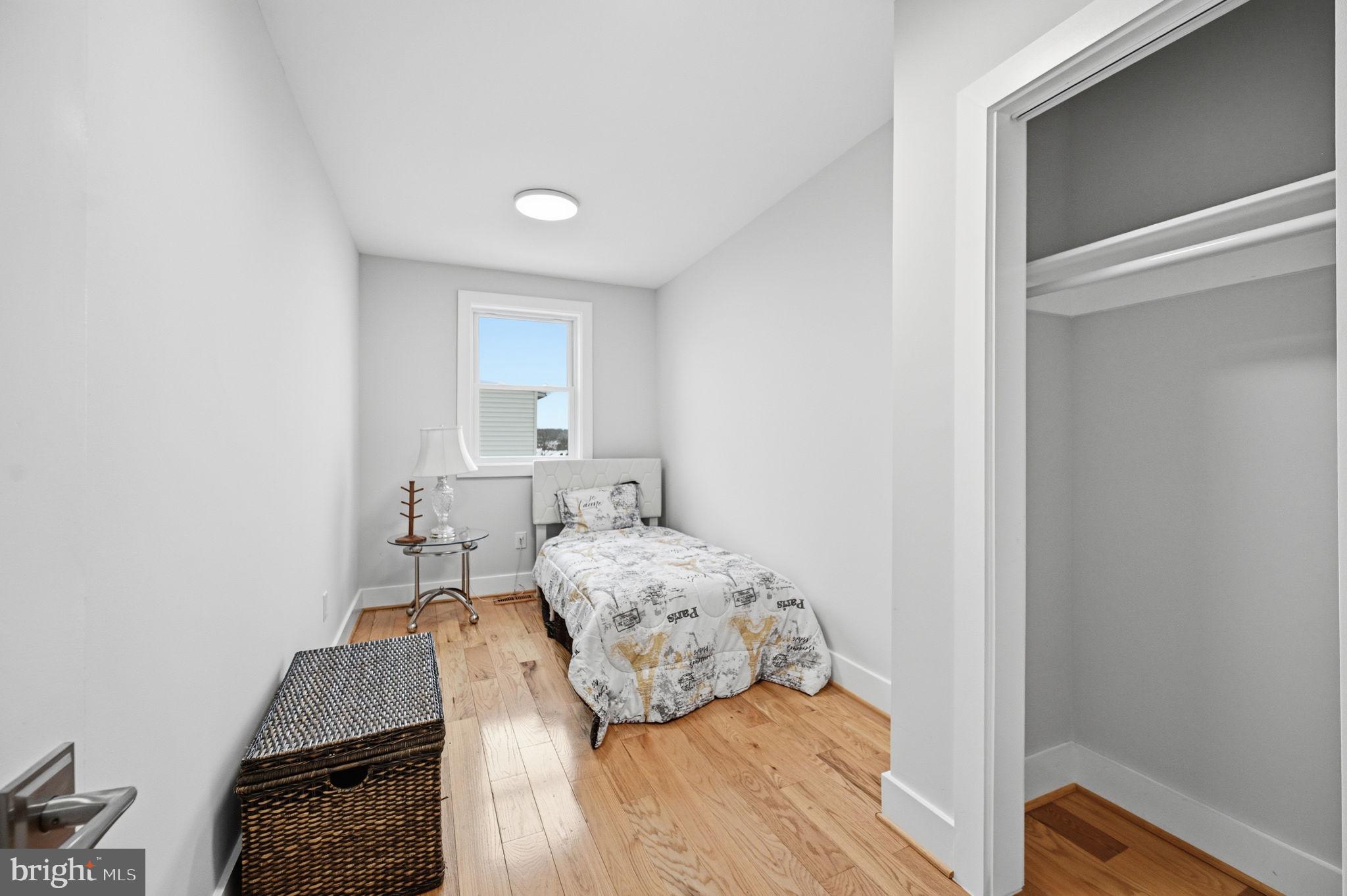 4902 4th Street Northwest Washington, DC 20011 - Photo 14 of 24 a bedroom with a bed and a window