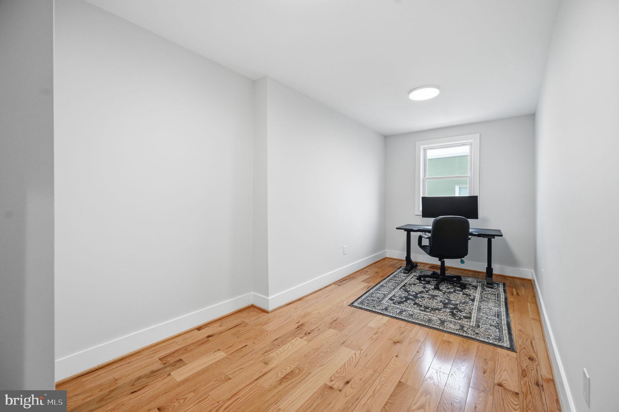 4902 4th Street Northwest Washington, DC 20011 - Photo 15 of 24 a living room with a rug and a table