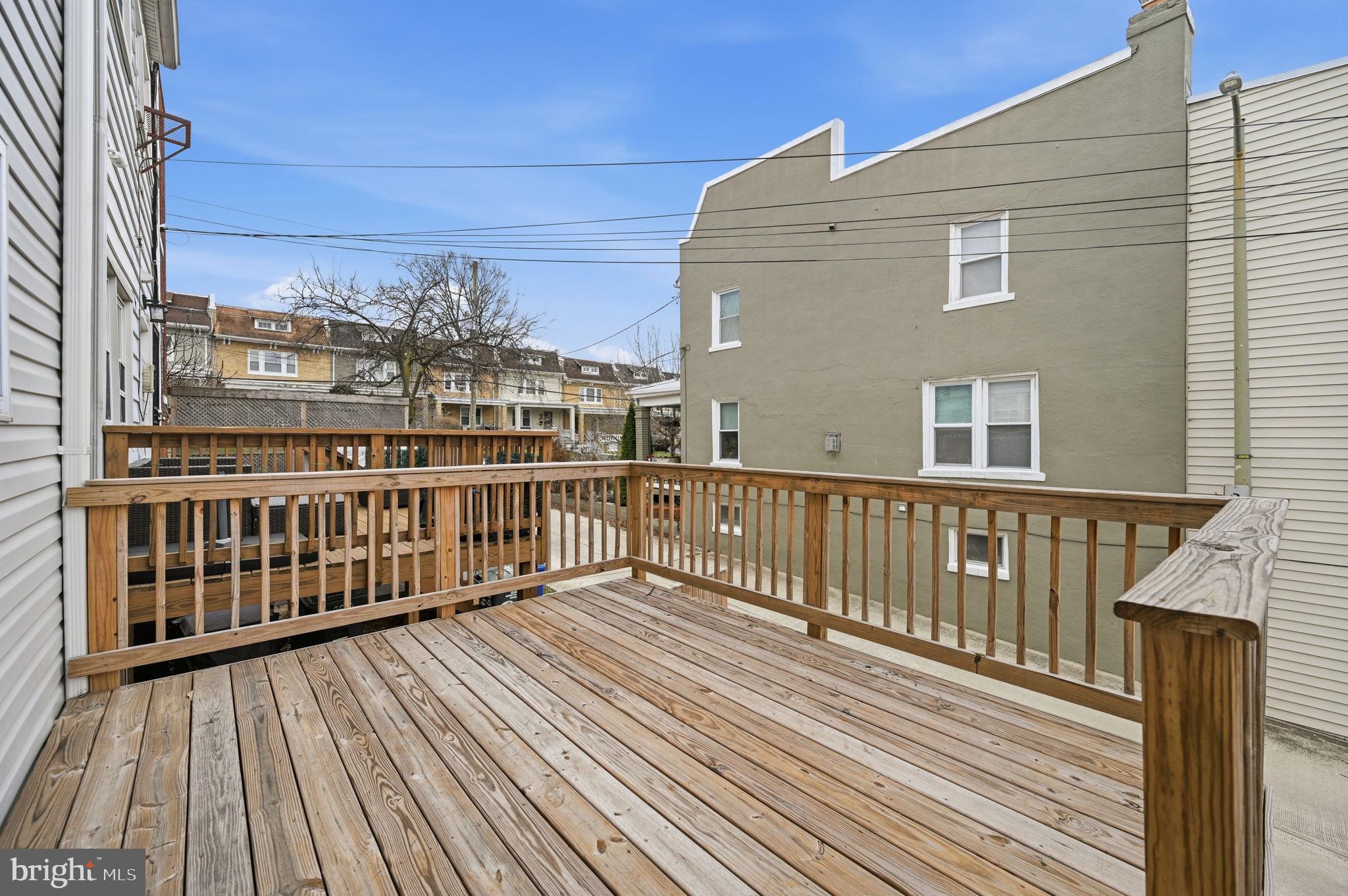 4902 4th Street Northwest Washington, DC 20011 - Photo 22 of 24 a view of a balcony with wooden floor and fence