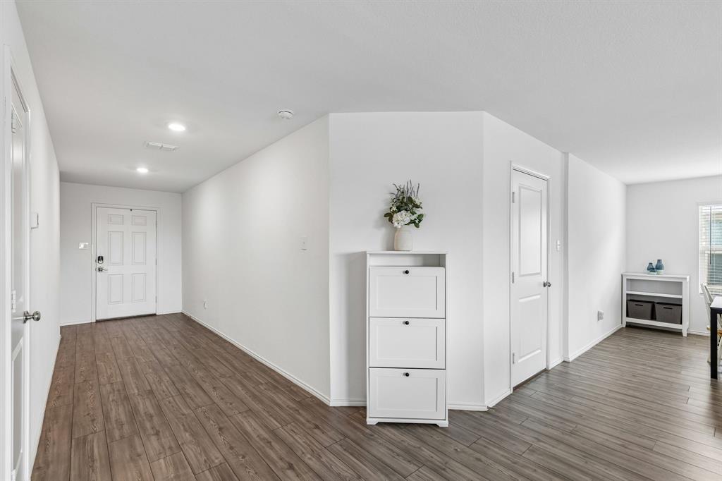 3044 Harper Street Little Elm, TX 75068 - Photo 12 of 24 a view of an empty room and wooden floor