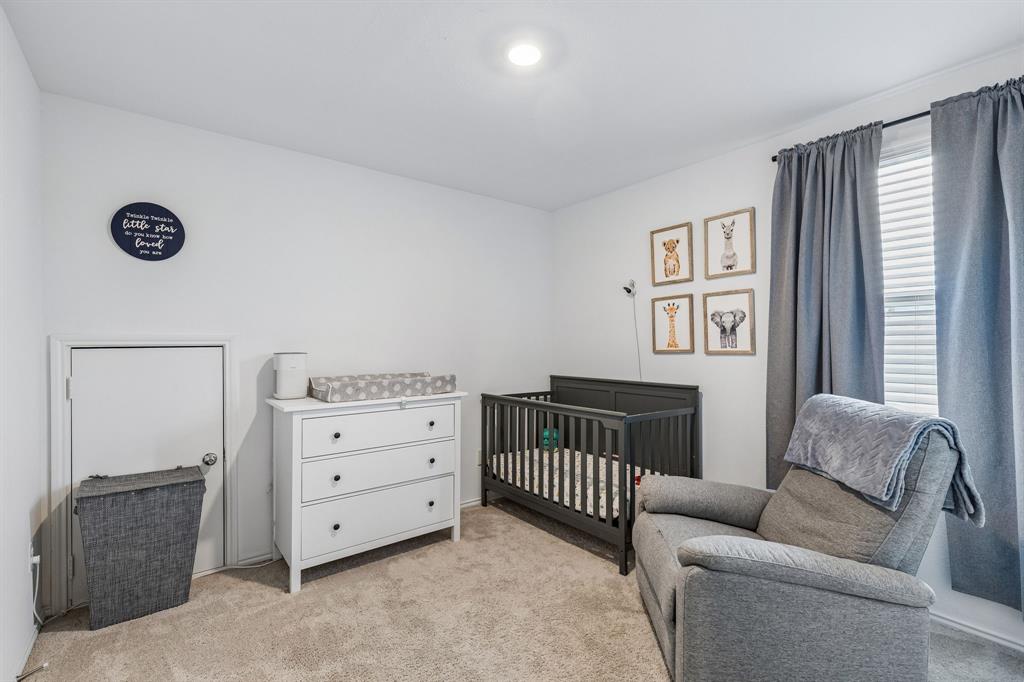 3044 Harper Street Little Elm, TX 75068 - Photo 14 of 24 a bedroom with furniture and a window