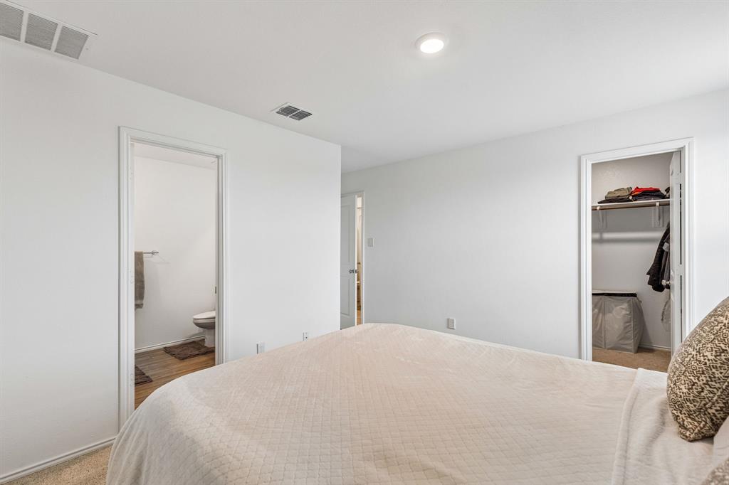 3044 Harper Street Little Elm, TX 75068 - Photo 17 of 24 a bedroom with a bed and a window