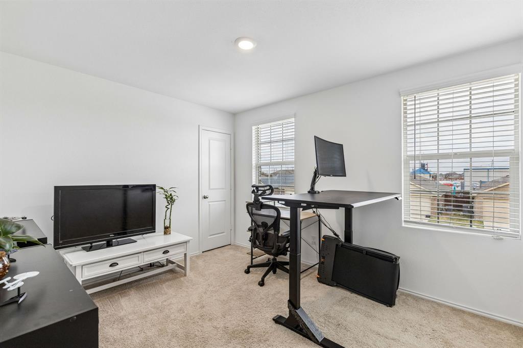 3044 Harper Street Little Elm, TX 75068 - Photo 20 of 24 a view of a livingroom with workspace and a window