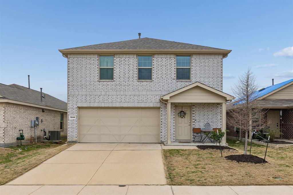 3044 Harper Street Little Elm, TX 75068 - Photo 2 of 24 a front view of a house with garden