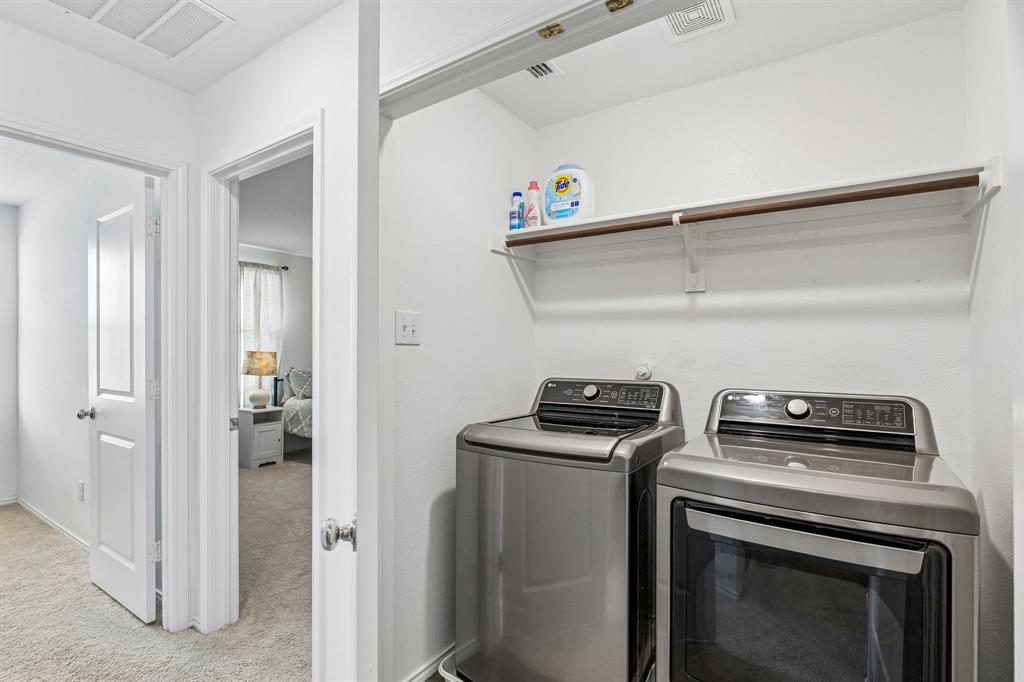 3044 Harper Street Little Elm, TX 75068 - Photo 22 of 24 a view of storage and utility room with washer and dryer
