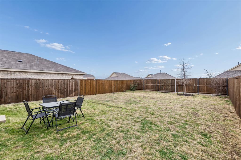 3044 Harper Street Little Elm, TX 75068 - Photo 23 of 24 a view of a backyard with table and chairs