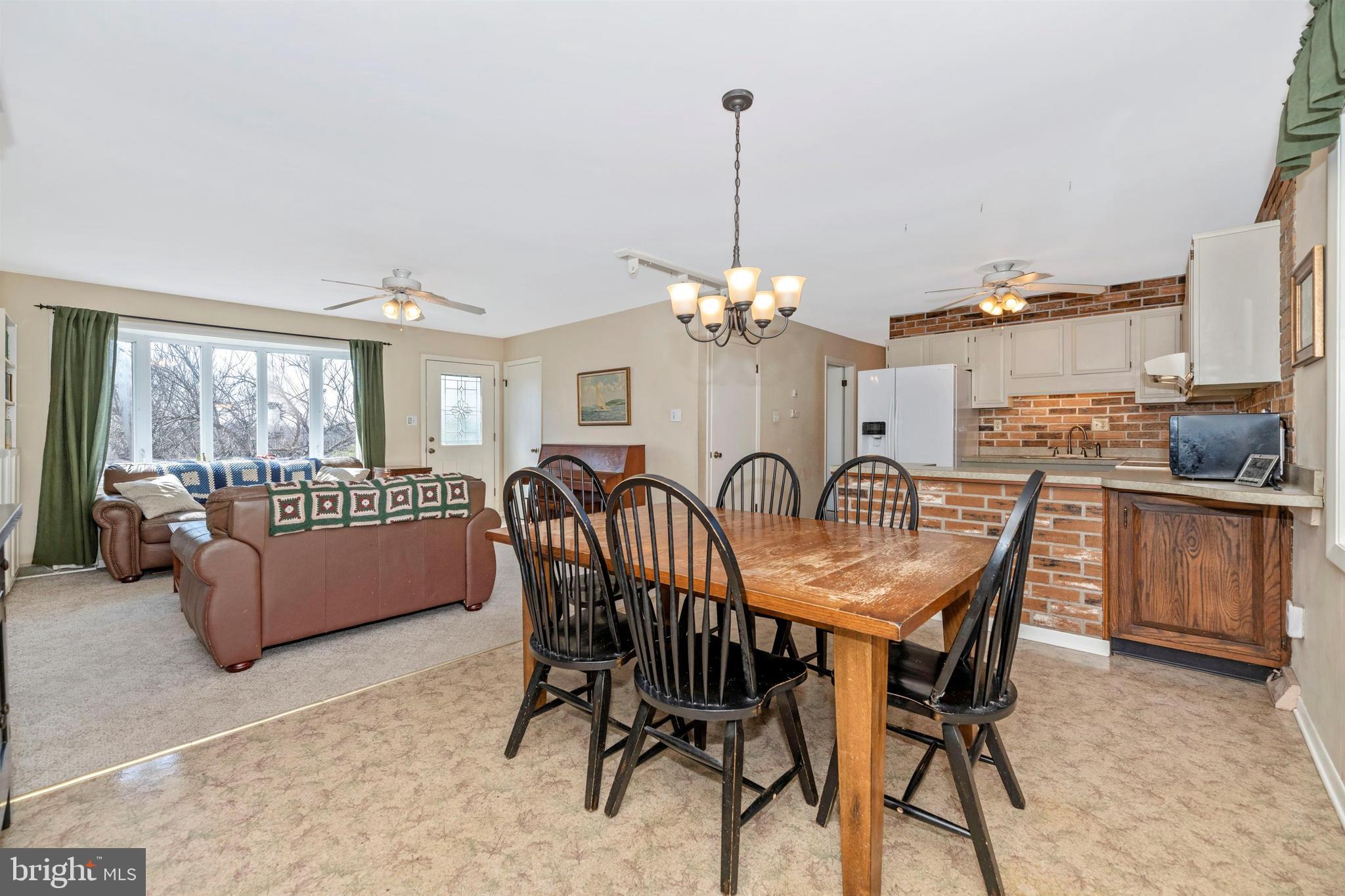 20824 Netz Road Boonsboro, MD 21713 - Photo 8 of 53 a dining room with furniture a chandelier and window