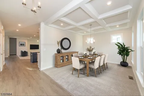 a dining room with a table and chairs