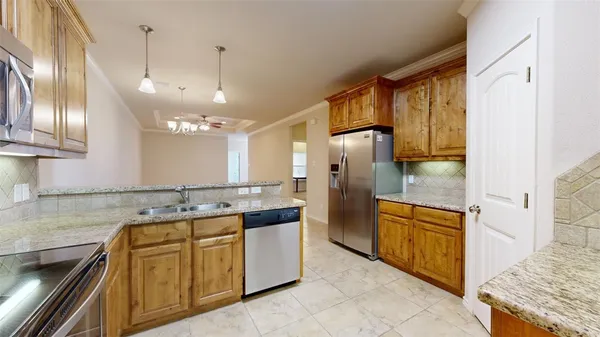 a kitchen with a sink stove and refrigerator