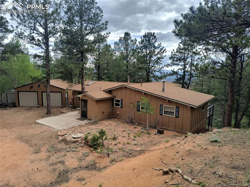 a view of a house with a yard covered in snow