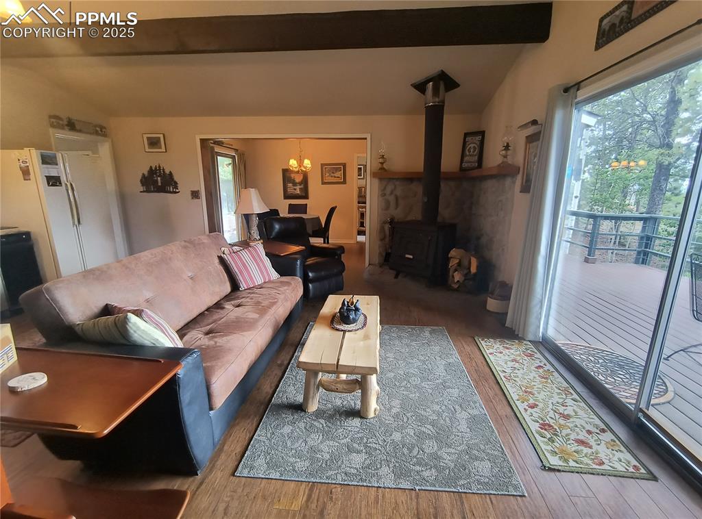 237 Blue Spruce Road Divide, CO 80814 - Photo 17 of 47 a living room with furniture rug and wooden floor