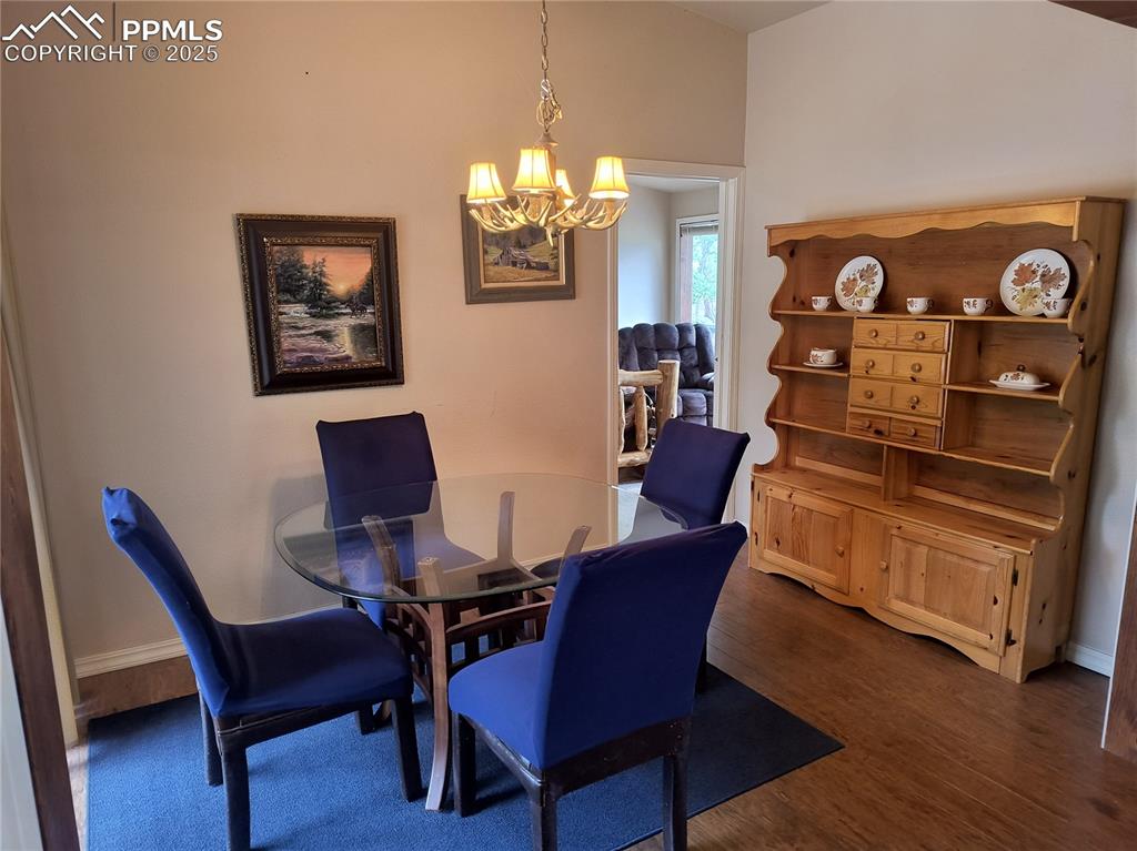 237 Blue Spruce Road Divide, CO 80814 - Photo 20 of 47 a view of a dining room with furniture
