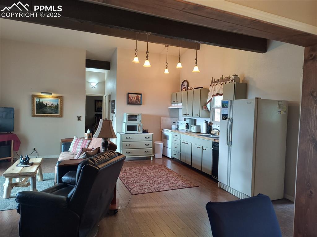 237 Blue Spruce Road Divide, CO 80814 - Photo 22 of 47 a living room with furniture and a kitchen