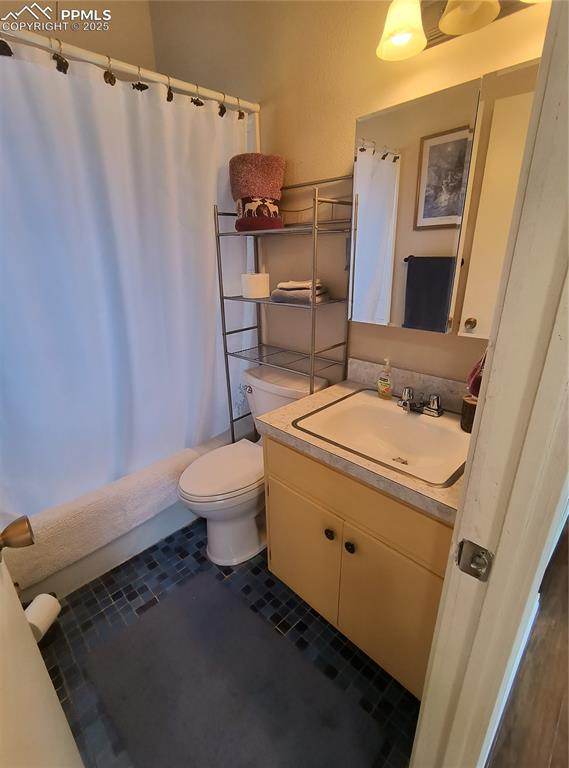 237 Blue Spruce Road Divide, CO 80814 - Photo 32 of 47 a bathroom with a sink toilet and shower