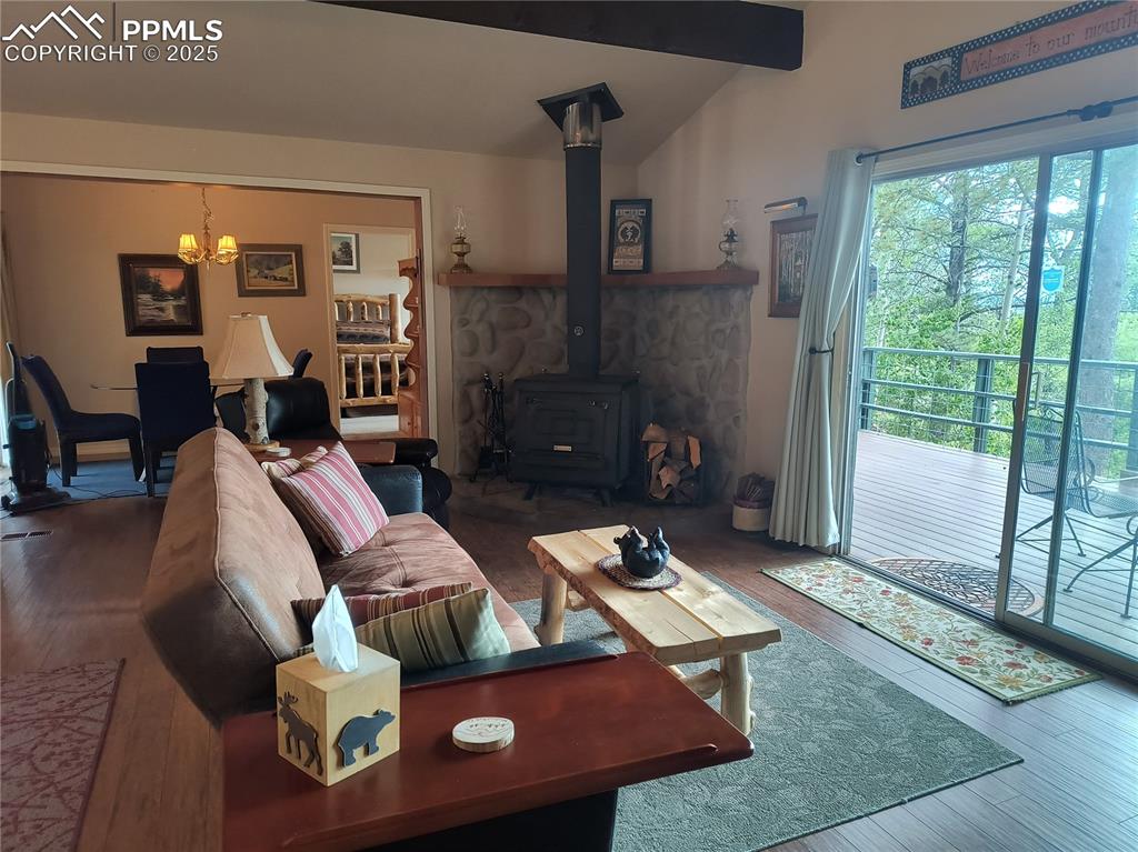 237 Blue Spruce Road Divide, CO 80814 - Photo 33 of 47 a living room with furniture and a fireplace