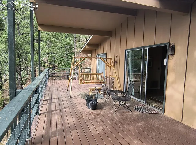 a view of a house with wooden floor and outdoor seating