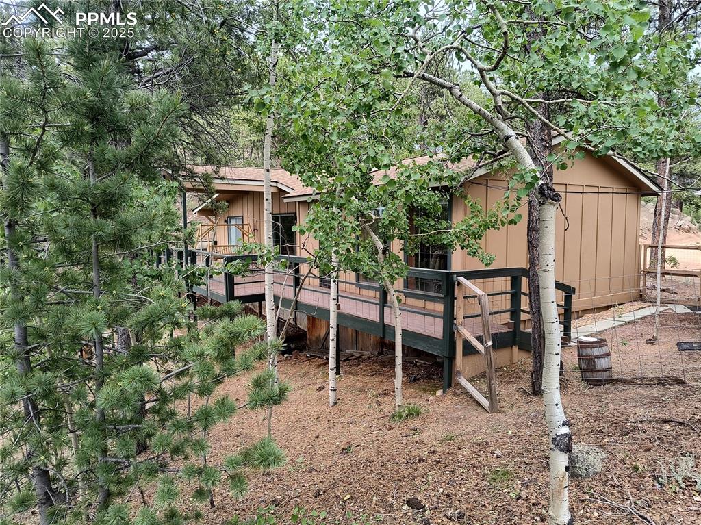 237 Blue Spruce Road Divide, CO 80814 - Photo 38 of 47 a view of a chairs and table in backyard