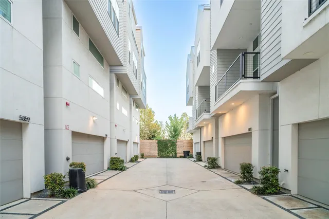 a view of a white apartments with large windows