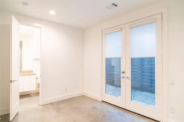 a view of an empty room with cabinet