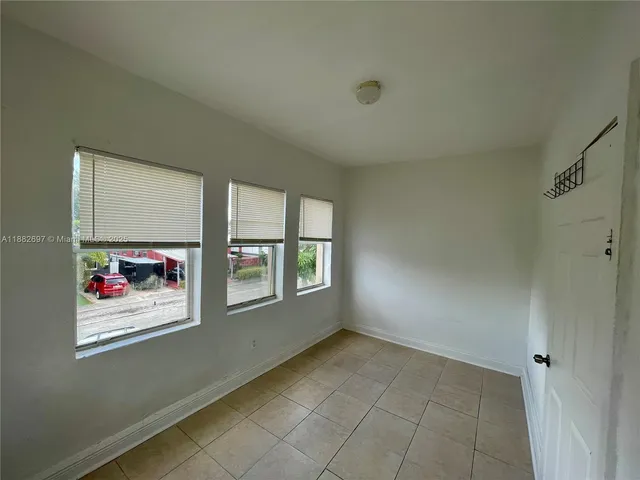 an empty room with windows