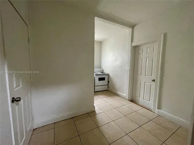 a kitchen with a stove sink and refrigerator