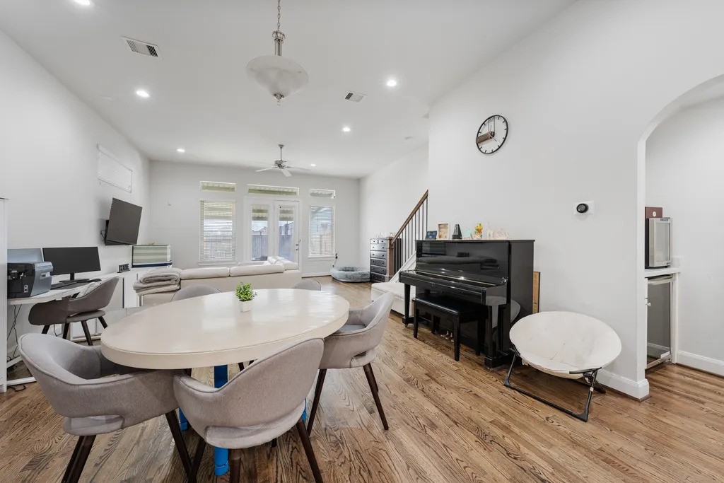 3022 Maxroy Street Houston, TX 77008 - Photo 8 of 21 a living room with furniture a piano and a flat screen tv