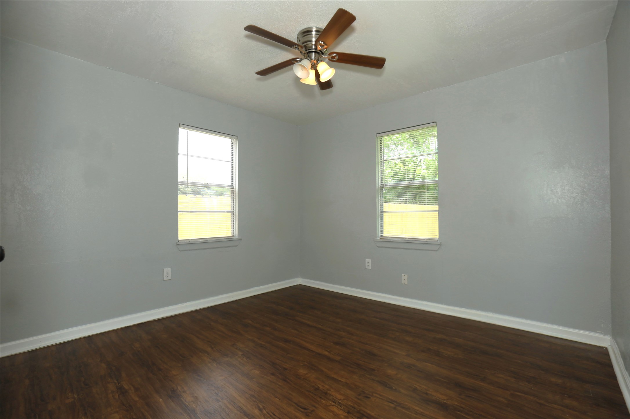 713 South Valderas Street Angleton, TX 77515 - Photo 5 of 10 a view of a room with wooden floor and a window