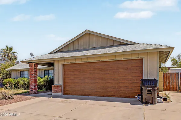 a front view of house with garage