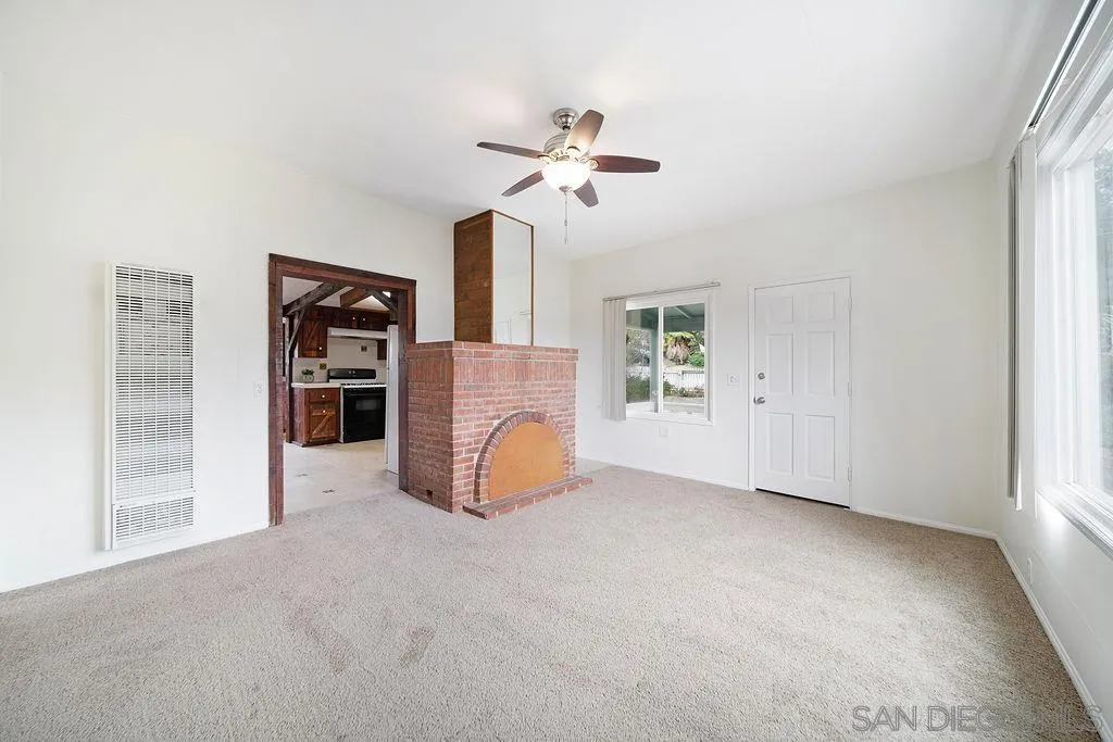 2924 Helix Street Spring Valley, CA 91977 - Photo 11 of 30 a view of a livingroom with a furniture and a ceiling fan