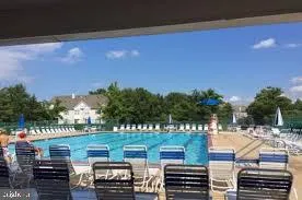 a view of a swimming pool with a patio