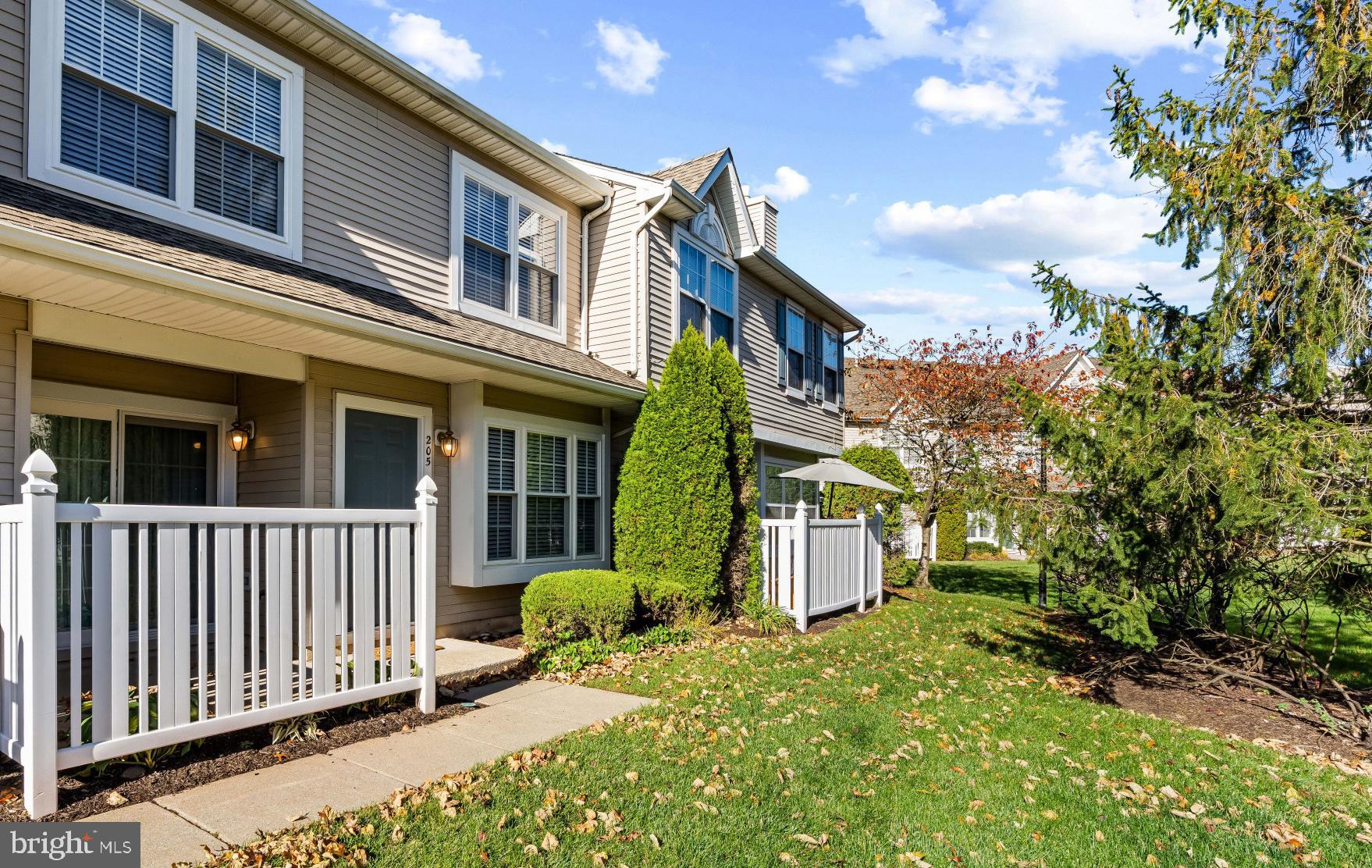 205 Kirby Way Mount Laurel, NJ 08054 - Photo 3 of 26 a view of a house with brick walls and a yard with plants